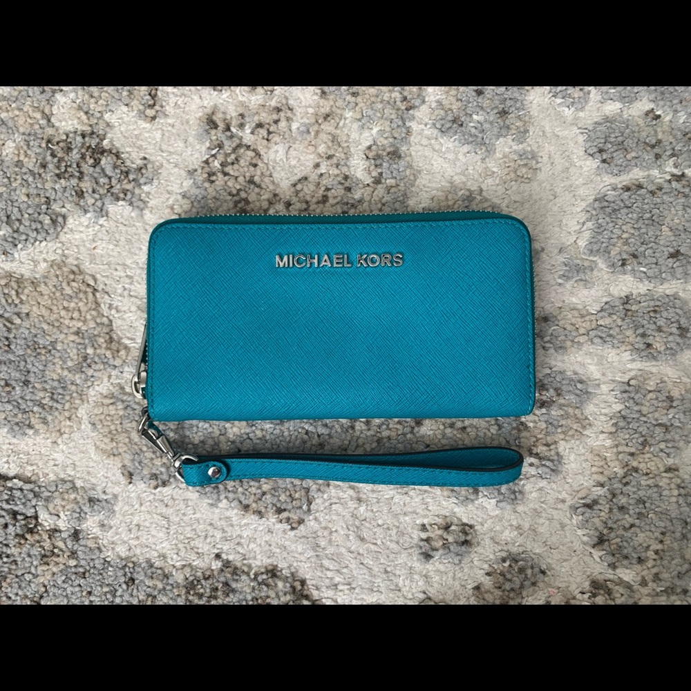 Michael Kors wallet with detachable wristlet. Color blue with silver hardware.